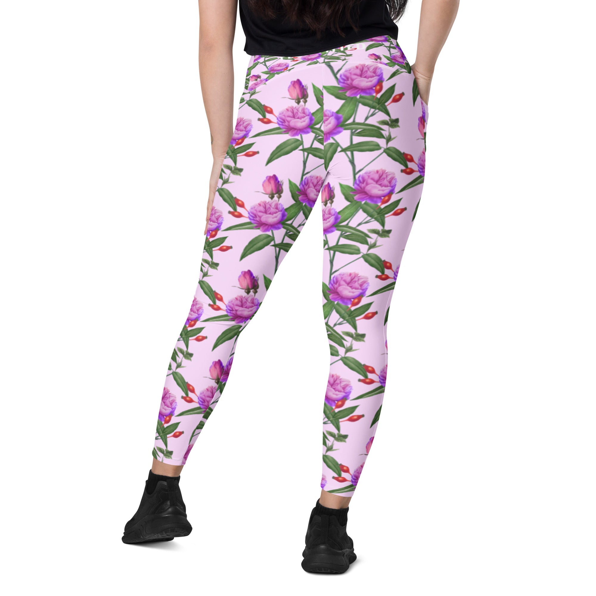 https://flowfitted.com/cdn/shop/products/all-over-print-crossover-leggings-with-pockets-white-back-62f13bb642a1a_2000x.jpg?v=1659976643